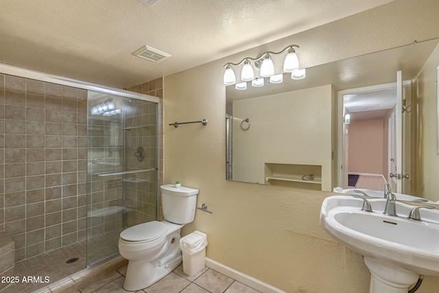 4114 E Muirwood Dr, Phoenix, AZ 85048 - bathroom with tile patterned flooring, toilet, a stall shower, a textured ceiling, and a textured wall