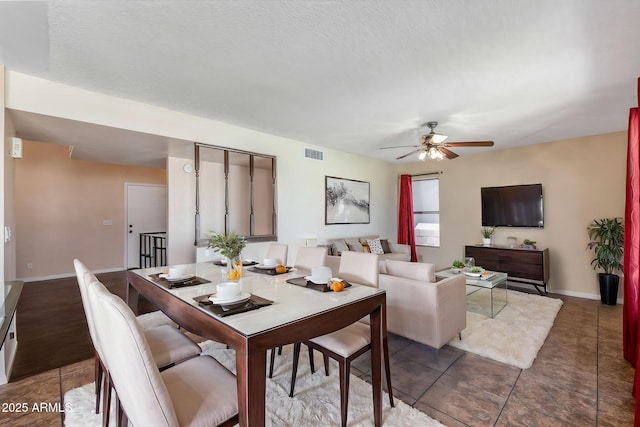 4114 E Muirwood Dr, Phoenix, AZ 85048 - dining area featuring a ceiling fan, baseboards, and tile patterned floors