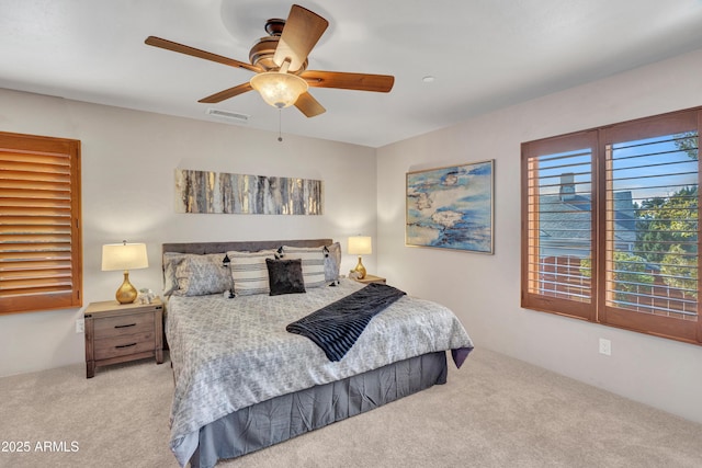 carpeted bedroom featuring ceiling fan