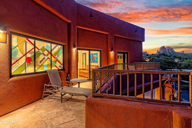 view of balcony at dusk