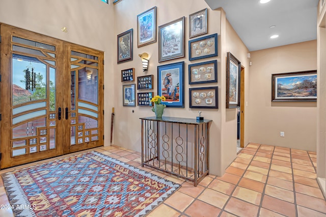 tiled entrance foyer featuring french doors