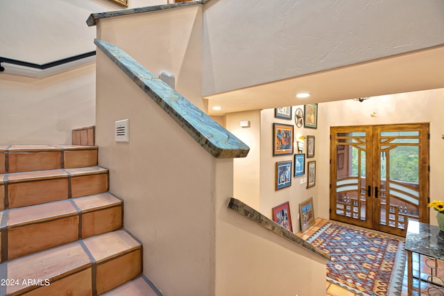 stairs with french doors