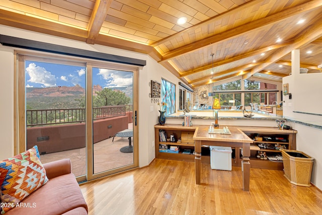 interior space with wooden ceiling, light hardwood / wood-style floors, and vaulted ceiling with beams