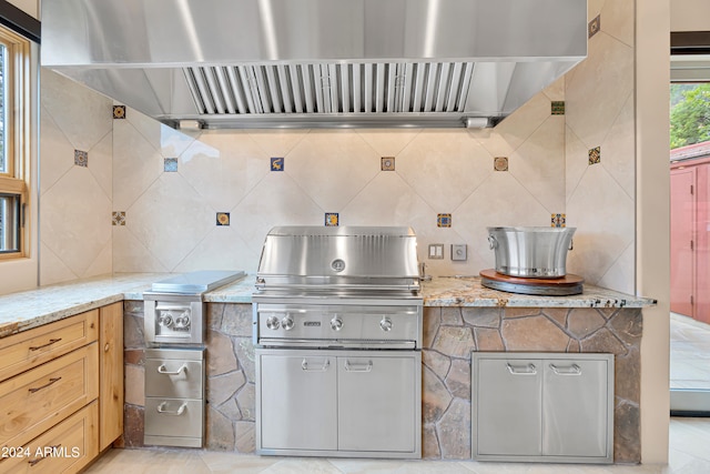 view of patio / terrace featuring a grill and exterior kitchen