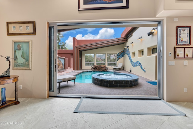 doorway featuring light tile patterned flooring