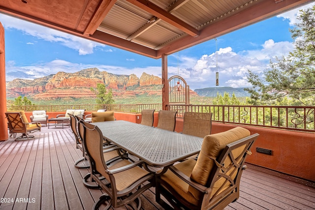 wooden deck featuring a mountain view