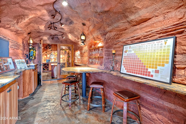 bar with concrete flooring