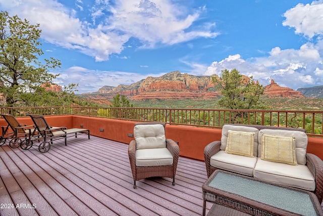 wooden terrace with a mountain view