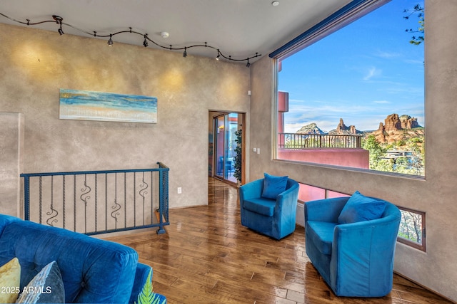 sitting room with hardwood / wood-style flooring