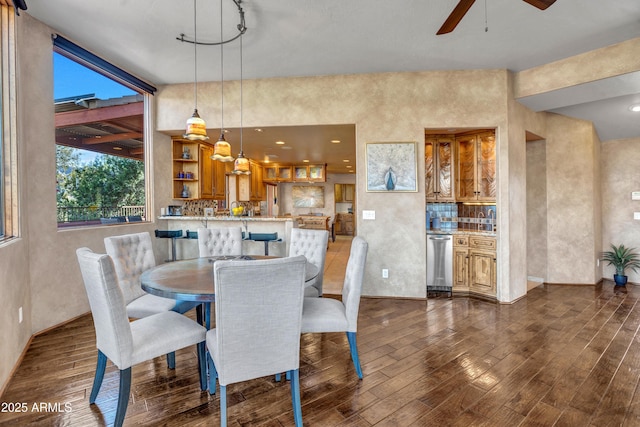 dining space with dark hardwood / wood-style flooring and ceiling fan