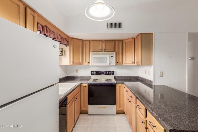 kitchen with sink and white appliances