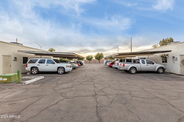 view of vehicle parking with a carport