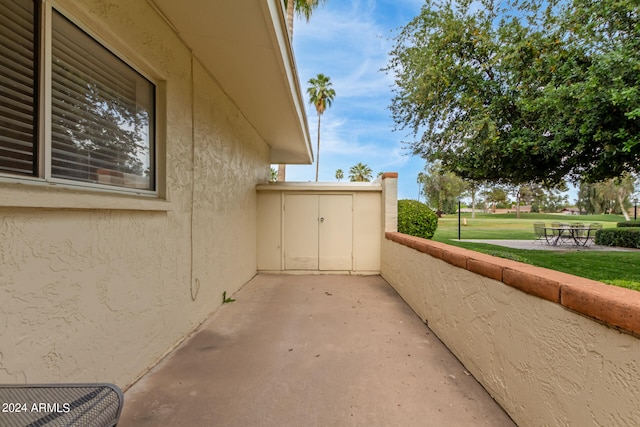 view of property exterior with a lawn