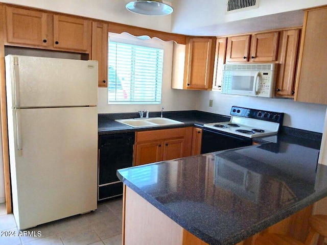 kitchen featuring white appliances, light tile patterned floors, and sink