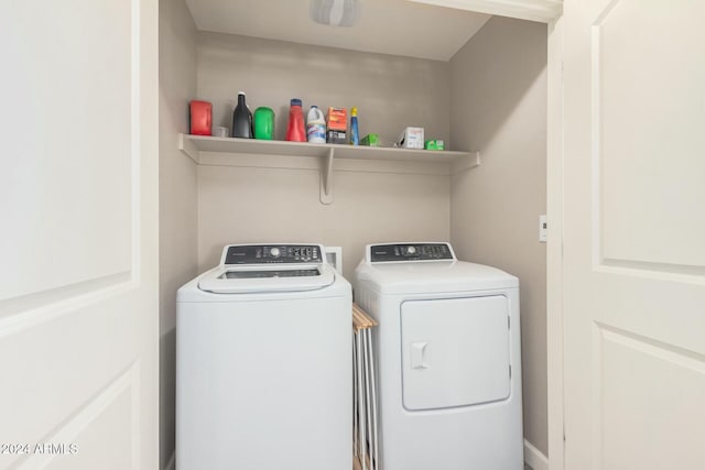 laundry room featuring washing machine and dryer