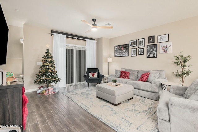 living room with hardwood / wood-style floors and ceiling fan