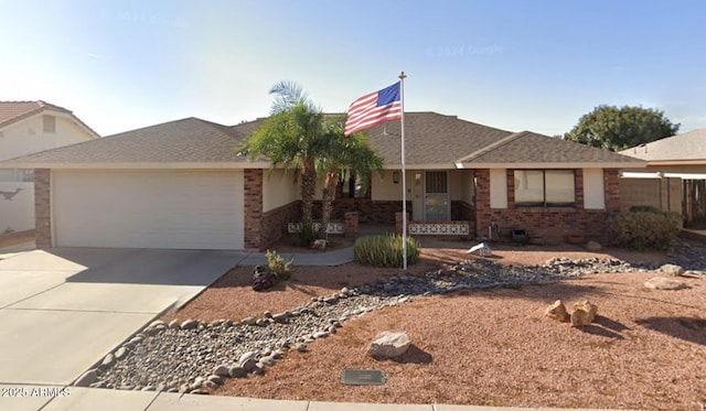 single story home with a garage, concrete driveway, and brick siding