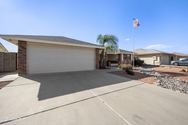 ranch-style house with brick siding and driveway