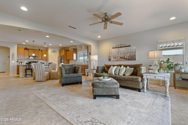 living room featuring ceiling fan