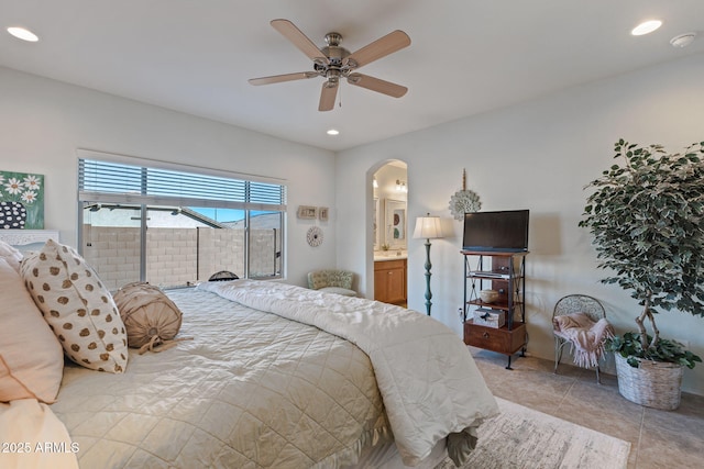 bedroom featuring ceiling fan and connected bathroom