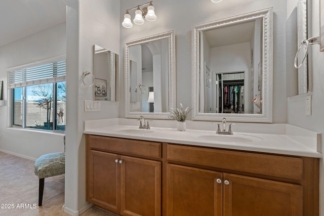 bathroom with tile patterned floors and vanity