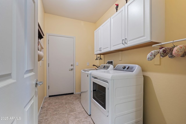 laundry area with cabinets and independent washer and dryer