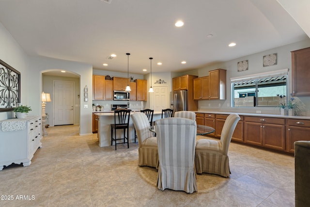 dining area with light tile patterned floors