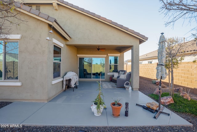 view of patio with ceiling fan