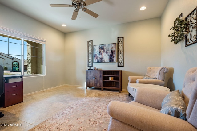 living room with light tile patterned floors and ceiling fan