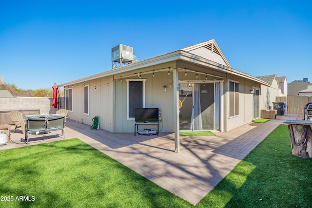 rear view of property with a yard, a patio area, fence, and central air condition unit