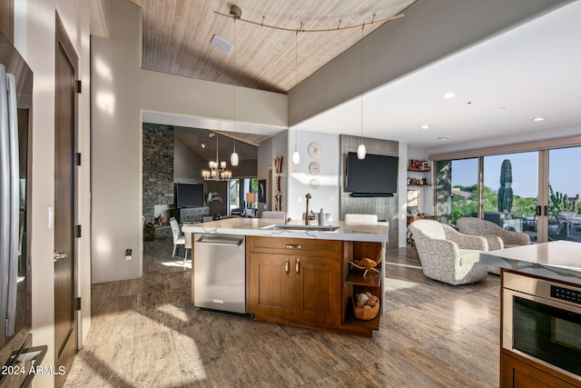 kitchen with sink, hanging light fixtures, wooden ceiling, a notable chandelier, and stainless steel appliances