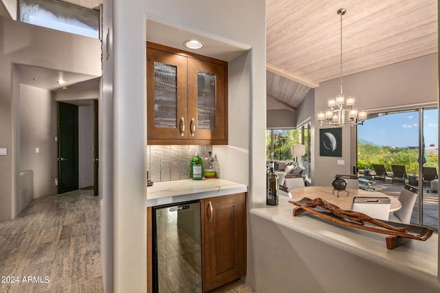 interior space with wood ceiling, backsplash, vaulted ceiling with beams, wine cooler, and a notable chandelier