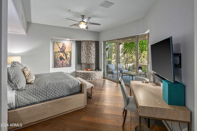 bedroom with wood-type flooring, access to exterior, and ceiling fan