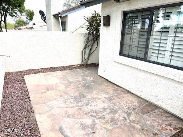 view of patio with fence