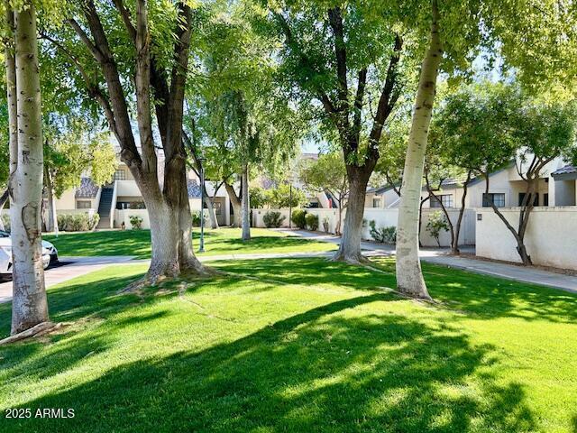 view of yard with fence and a residential view