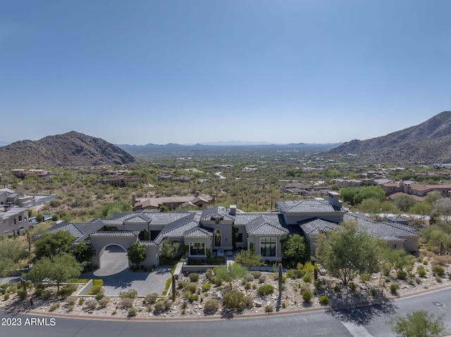 birds eye view of property featuring a mountain view