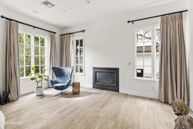 sitting room featuring light hardwood / wood-style floors