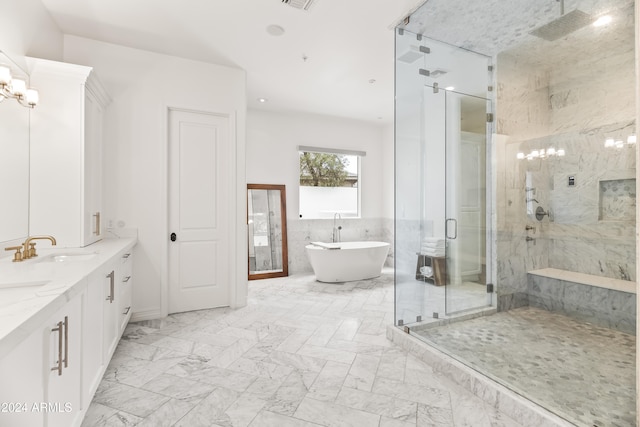 bathroom featuring vanity, tile walls, and shower with separate bathtub