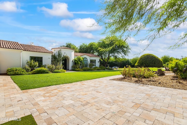 exterior space featuring a front lawn