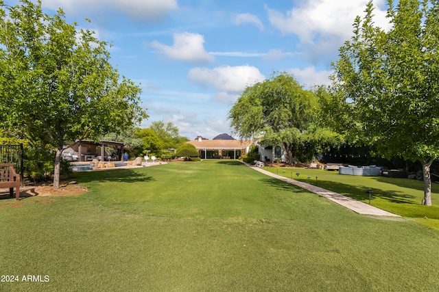 surrounding community featuring a yard