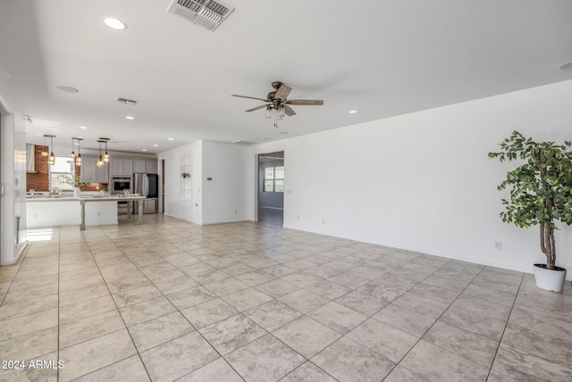 9645 E Theia Dr, Mesa, AZ 85212 - unfurnished living room with ceiling fan, recessed lighting, and light tile patterned flooring