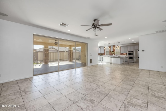 9645 E Theia Dr, Mesa, AZ 85212 - unfurnished living room with ceiling fan, light tile patterned floors, recessed lighting, and baseboards