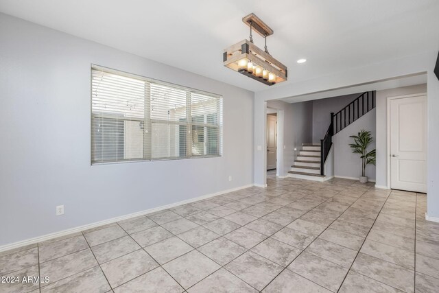 9645 E Theia Dr, Mesa, AZ 85212 - spare room with stairway, light tile patterned floors, baseboards, and recessed lighting