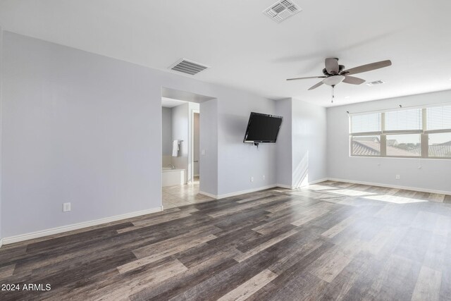 9645 E Theia Dr, Mesa, AZ 85212 - empty room featuring a ceiling fan, wood finished floors, and baseboards