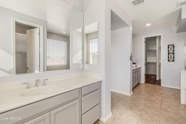 9645 E Theia Dr, Mesa, AZ 85212 - full bathroom with vanity, baseboards, tile patterned flooring, a spacious closet, and recessed lighting
