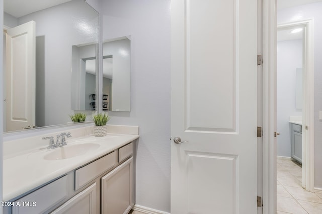 bathroom featuring vanity and tile patterned flooring