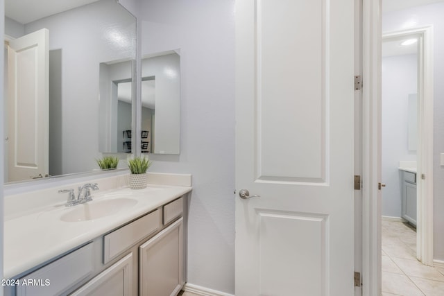 9645 E Theia Dr, Mesa, AZ 85212 - bathroom featuring vanity, tile patterned flooring, and baseboards