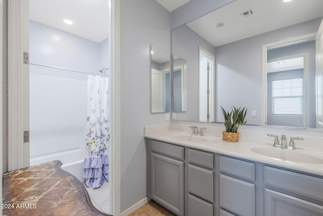 9645 E Theia Dr, Mesa, AZ 85212 - full bathroom with double vanity, shower / bath combo, tile patterned floors, and recessed lighting