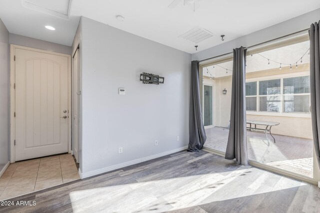 9645 E Theia Dr, Mesa, AZ 85212 - spare room with light wood finished floors, baseboards, a smoke detector, a pendent fire sprinkler, and recessed lighting