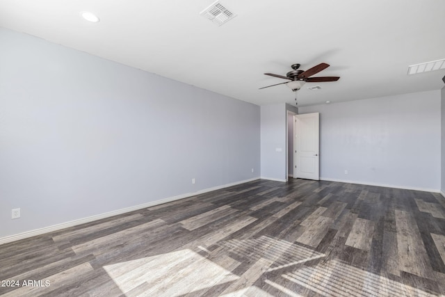 unfurnished room with dark hardwood / wood-style flooring and ceiling fan